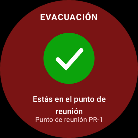 Pantalla de evacuación del reloj con un check verde: «Estás en el punto de reunión. Punto de reunión PR-1»